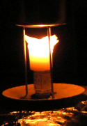 Pillar candle walls expanding outward, but still holding the melted wax