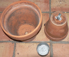 Clay pots and empty tin from canned chicken breast